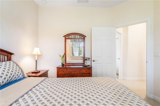 bedroom featuring light tile patterned flooring