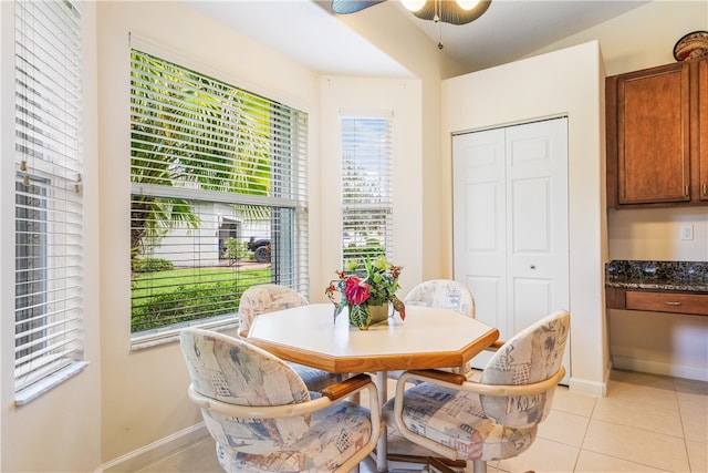 dining room with ceiling fan, light tile patterned floors, and a wealth of natural light