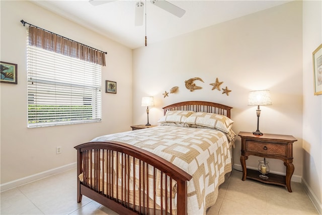 tiled bedroom with ceiling fan