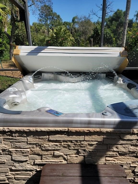 exterior details featuring a jacuzzi