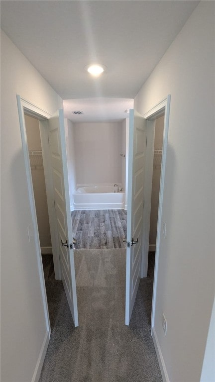 665 Rolling Hill Dr, Sebastian, FL 32958 - hall featuring carpet flooring and baseboards