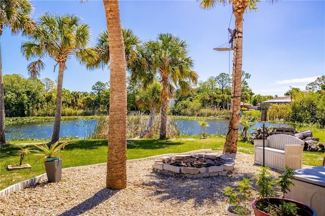 view of yard featuring a water view and a patio