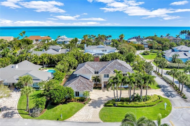 birds eye view of property featuring a residential view and a water view