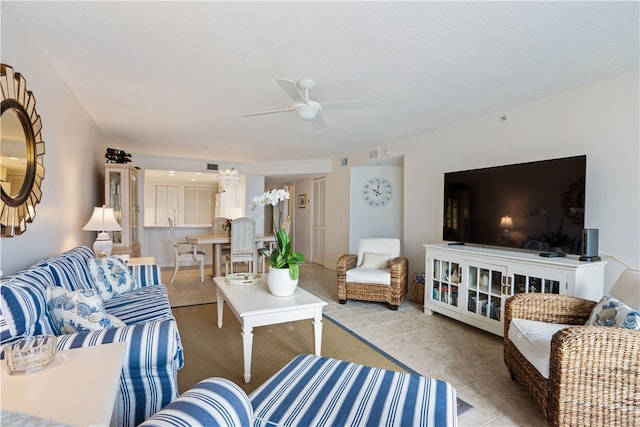 tiled living room featuring ceiling fan