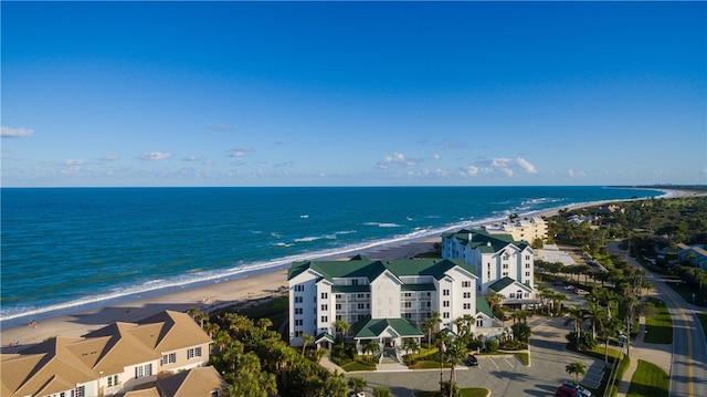 aerial view featuring a view of the beach and a water view