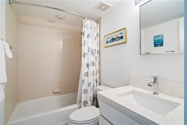 full bathroom featuring vanity, shower / bath combo, a textured ceiling, and toilet