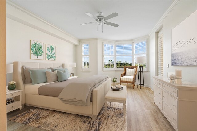 bedroom featuring ceiling fan, light hardwood / wood-style flooring, and crown molding