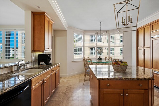 kitchen featuring a chandelier, pendant lighting, dishwasher, and a center island