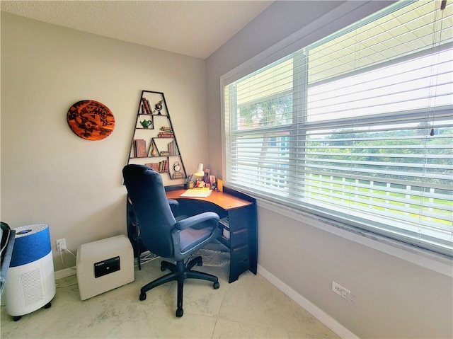 office space featuring a textured ceiling