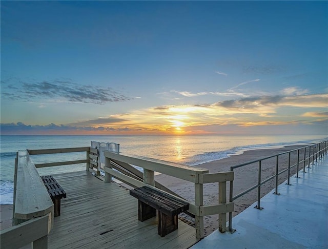 dock area featuring a view of the beach and a water view