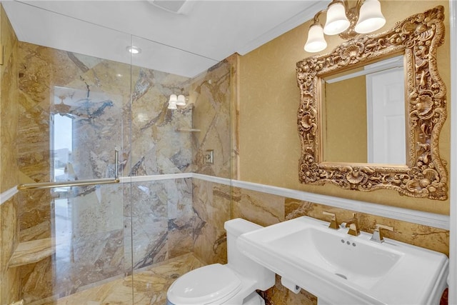 bathroom featuring an enclosed shower, sink, tile walls, and toilet