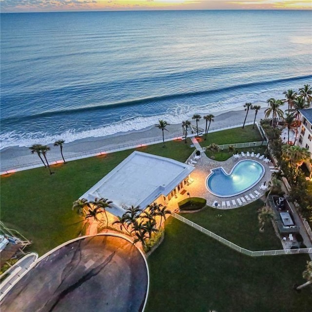 aerial view at dusk with a water view