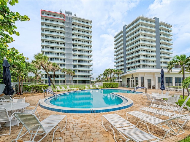 view of swimming pool with a patio