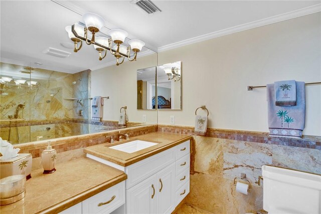 bathroom with a chandelier, vanity, an enclosed shower, toilet, and crown molding