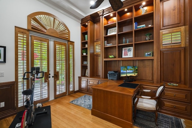 office space with crown molding, light hardwood / wood-style flooring, built in features, and french doors