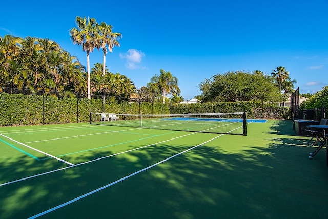 view of tennis court featuring basketball court