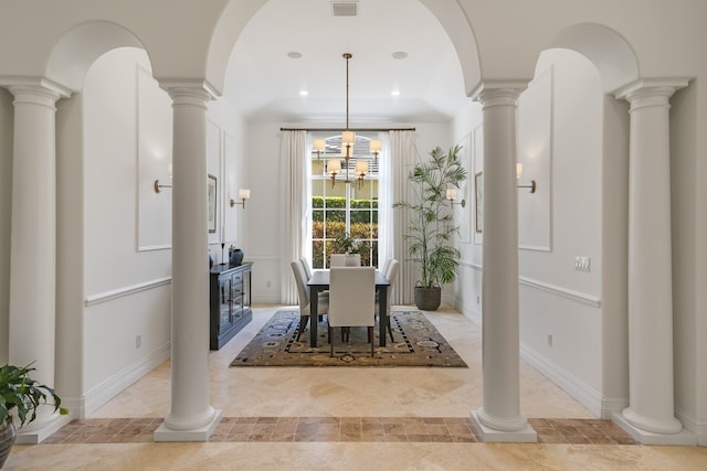 unfurnished dining area with ornate columns