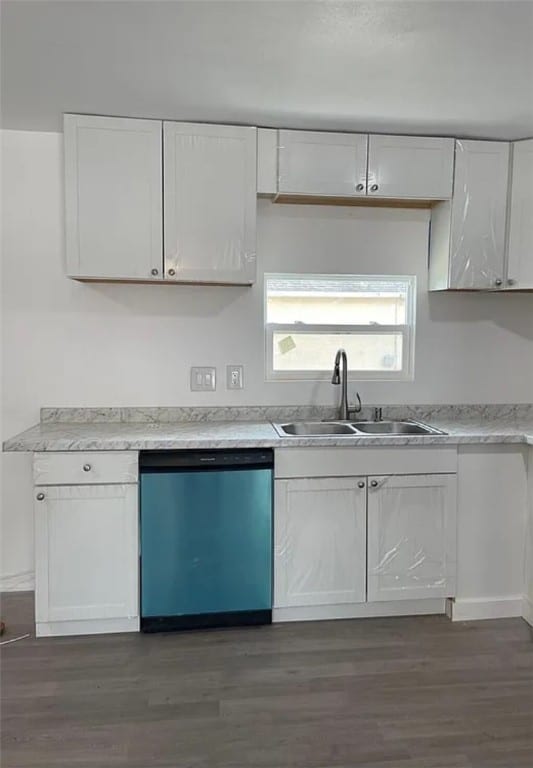 kitchen with dishwasher, dark hardwood / wood-style flooring, white cabinetry, and sink