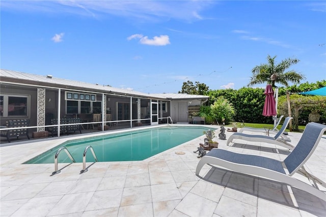 5541 Teal Ter, Fort Pierce, FL 34982 - swimming pool featuring a sunroom and a patio area