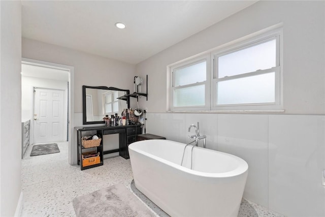 5541 Teal Ter, Fort Pierce, FL 34982 - bathroom with vanity, a freestanding bath, wainscoting, and recessed lighting