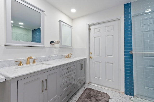 5541 Teal Ter, Fort Pierce, FL 34982 - full bath featuring double vanity, speckle patterned floor, a tile shower, and recessed lighting