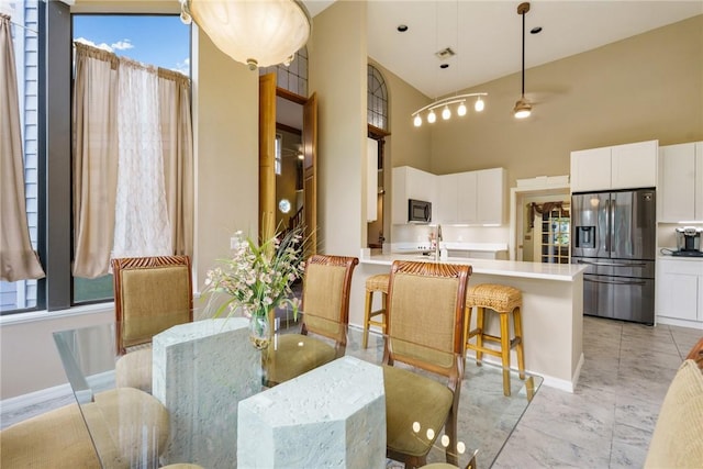 420 Sopwith Dr, Vero Beach, FL 32968 - dining area with a towering ceiling and baseboards