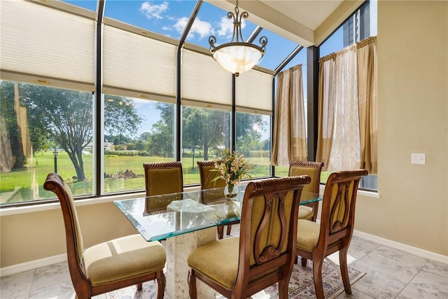 420 Sopwith Dr, Vero Beach, FL 32968 - sunroom / solarium with baseboards, a chandelier, and marble look tiles