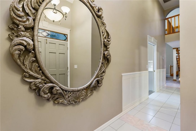 420 Sopwith Dr, Vero Beach, FL 32968 - entryway with light tile patterned floors, baseboards, and a high ceiling