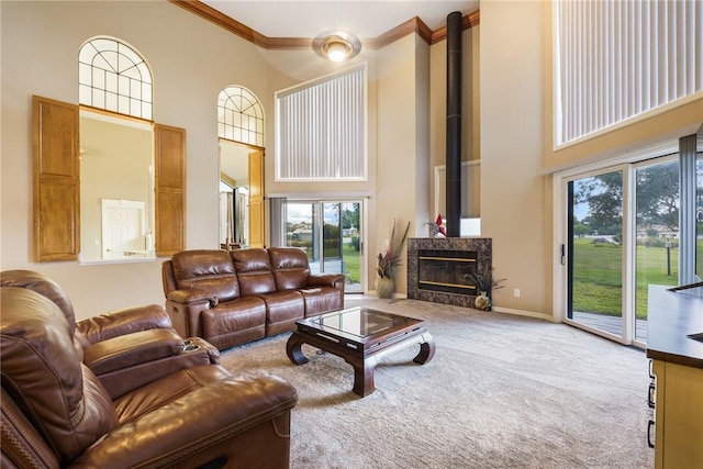 420 Sopwith Dr, Vero Beach, FL 32968 - living room featuring a towering ceiling, healthy amount of natural light, carpet flooring, ornamental molding, and baseboards