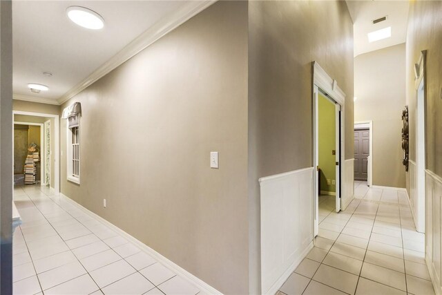420 Sopwith Dr, Vero Beach, FL 32968 - hallway featuring light tile patterned flooring and crown molding