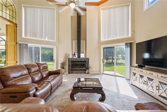 420 Sopwith Dr, Vero Beach, FL 32968 - carpeted living area with a towering ceiling, ceiling fan, plenty of natural light, and baseboards