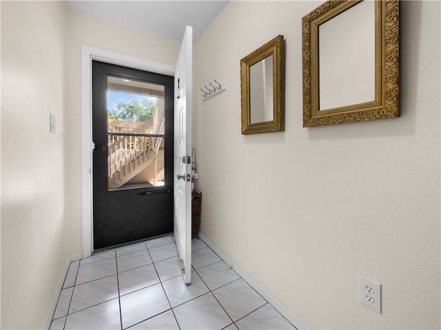 doorway featuring light tile patterned flooring