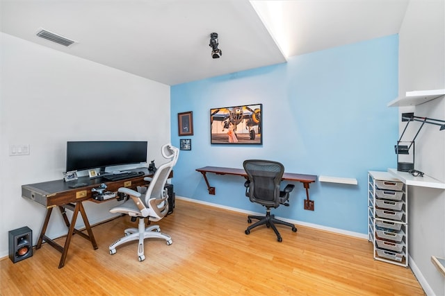 office space with hardwood / wood-style floors