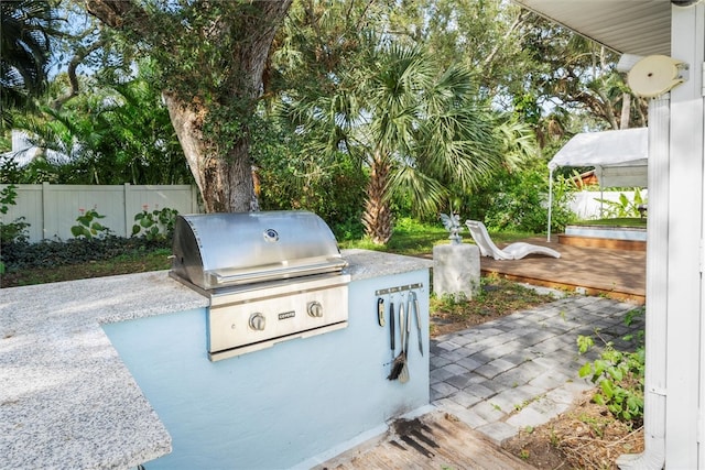 view of patio / terrace with a gazebo, exterior kitchen, and grilling area