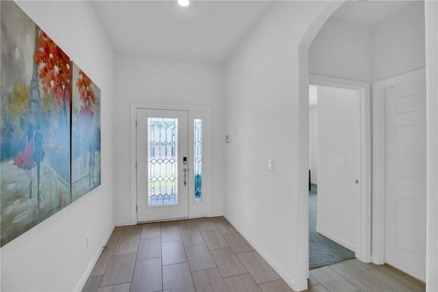 102 52nd Sq, Vero Beach, FL 32967 - entrance foyer featuring baseboards, recessed lighting, and arched walkways