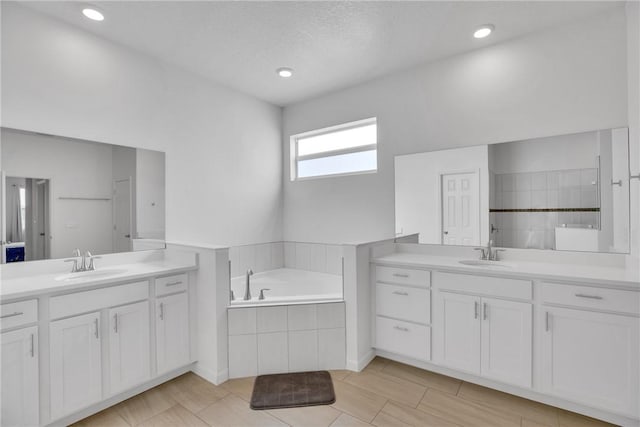 102 52nd Sq, Vero Beach, FL 32967 - full bathroom with a bath, two vanities, and a sink