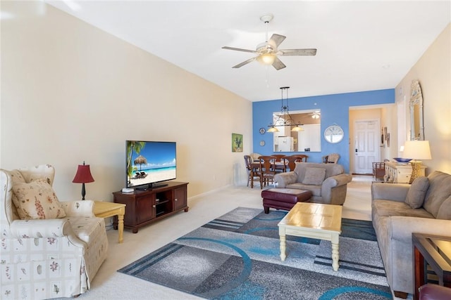 carpeted living room featuring ceiling fan