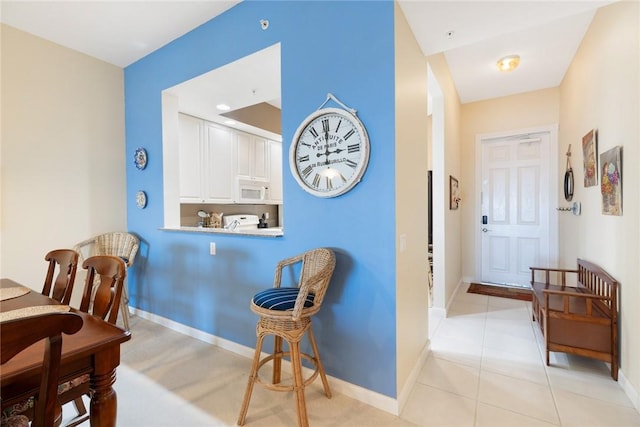 dining space with light tile patterned floors