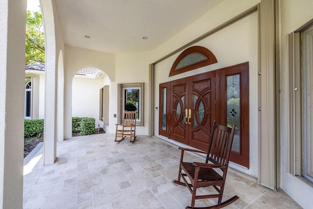 doorway to property with covered porch