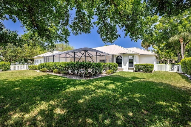 1765 E Rosewood Ct, Vero Beach, FL 32966 - view of front of property featuring a fenced backyard, stucco siding, glass enclosure, and a front yard