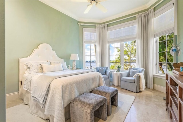 bedroom featuring ceiling fan and ornamental molding