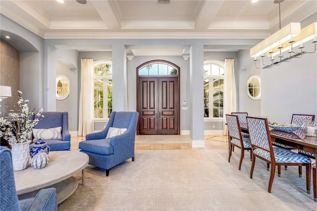 interior space featuring beamed ceiling, ornamental molding, and coffered ceiling