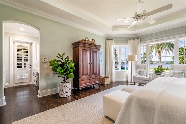 bedroom with access to exterior, ceiling fan, dark hardwood / wood-style floors, and ornamental molding