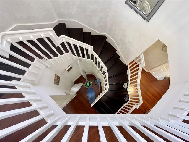 sitting room with dark wood-type flooring