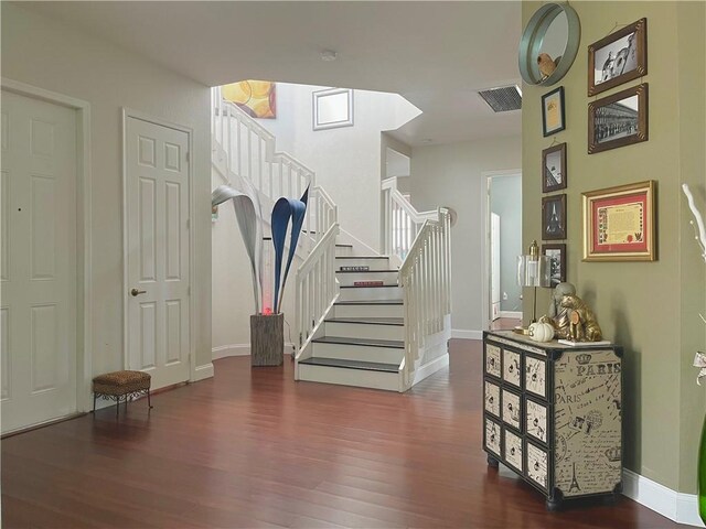 mudroom with dark hardwood / wood-style floors