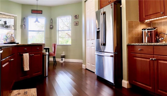 kitchen with backsplash, stainless steel fridge with ice dispenser, dark hardwood / wood-style flooring, and pendant lighting