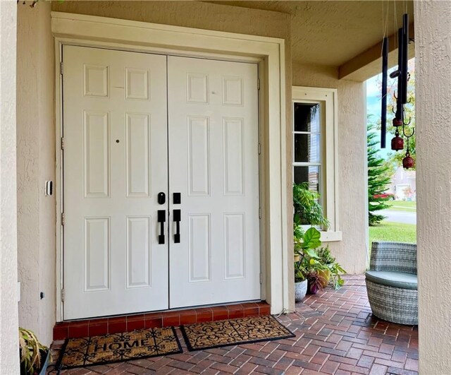 entrance to property with covered porch