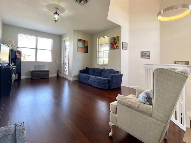 living room featuring dark hardwood / wood-style flooring