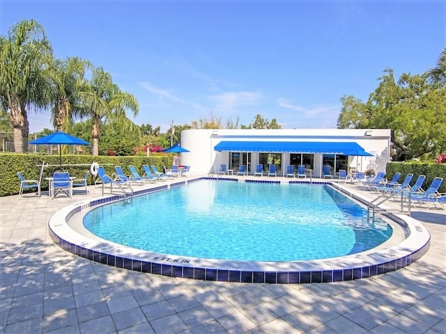 view of swimming pool featuring a patio area