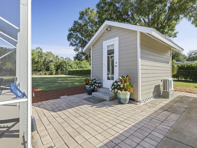 view of patio / terrace with an outbuilding